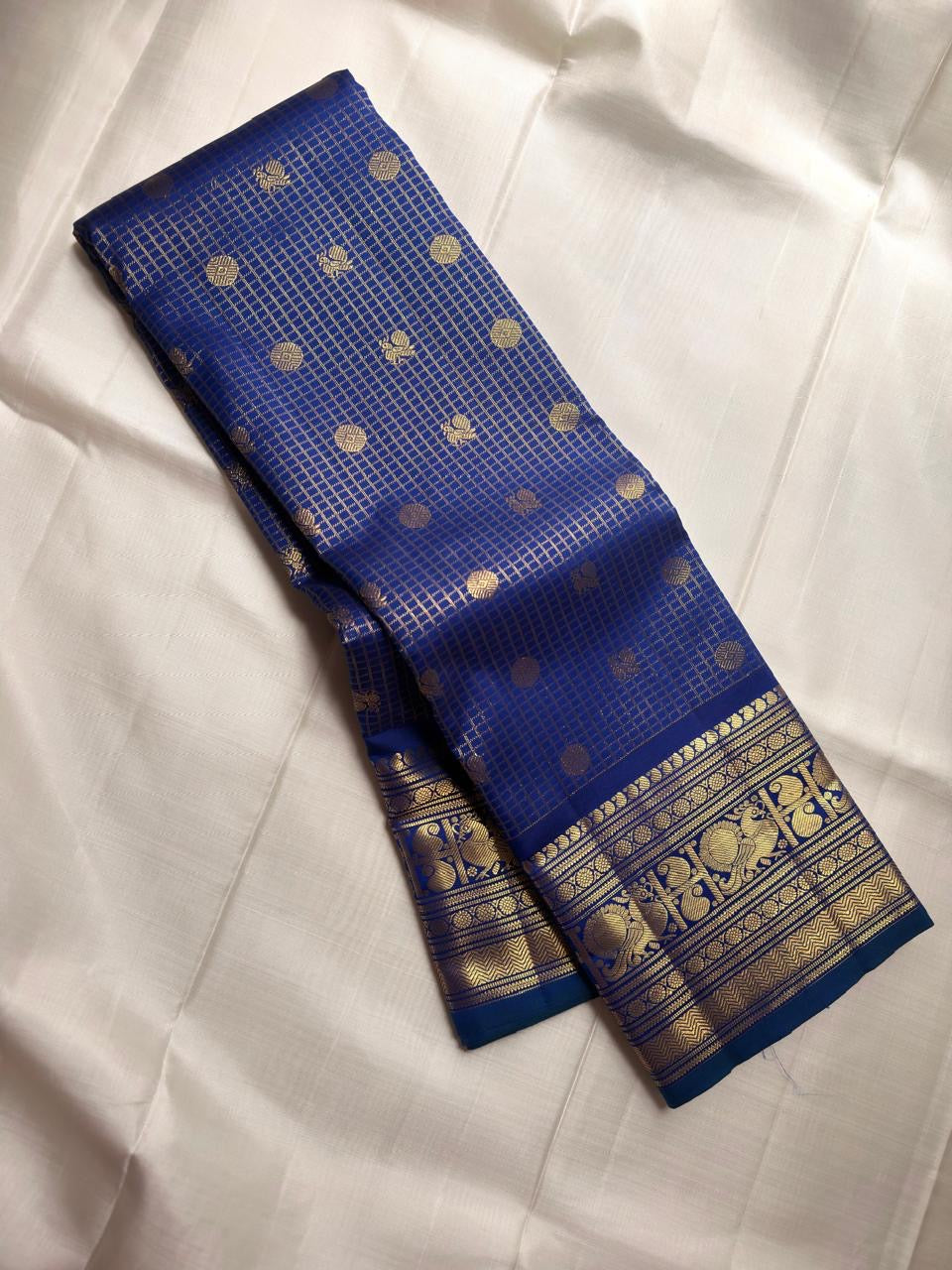 Royal blue pure silk Kanjipuram saree, close view of gold zari checks