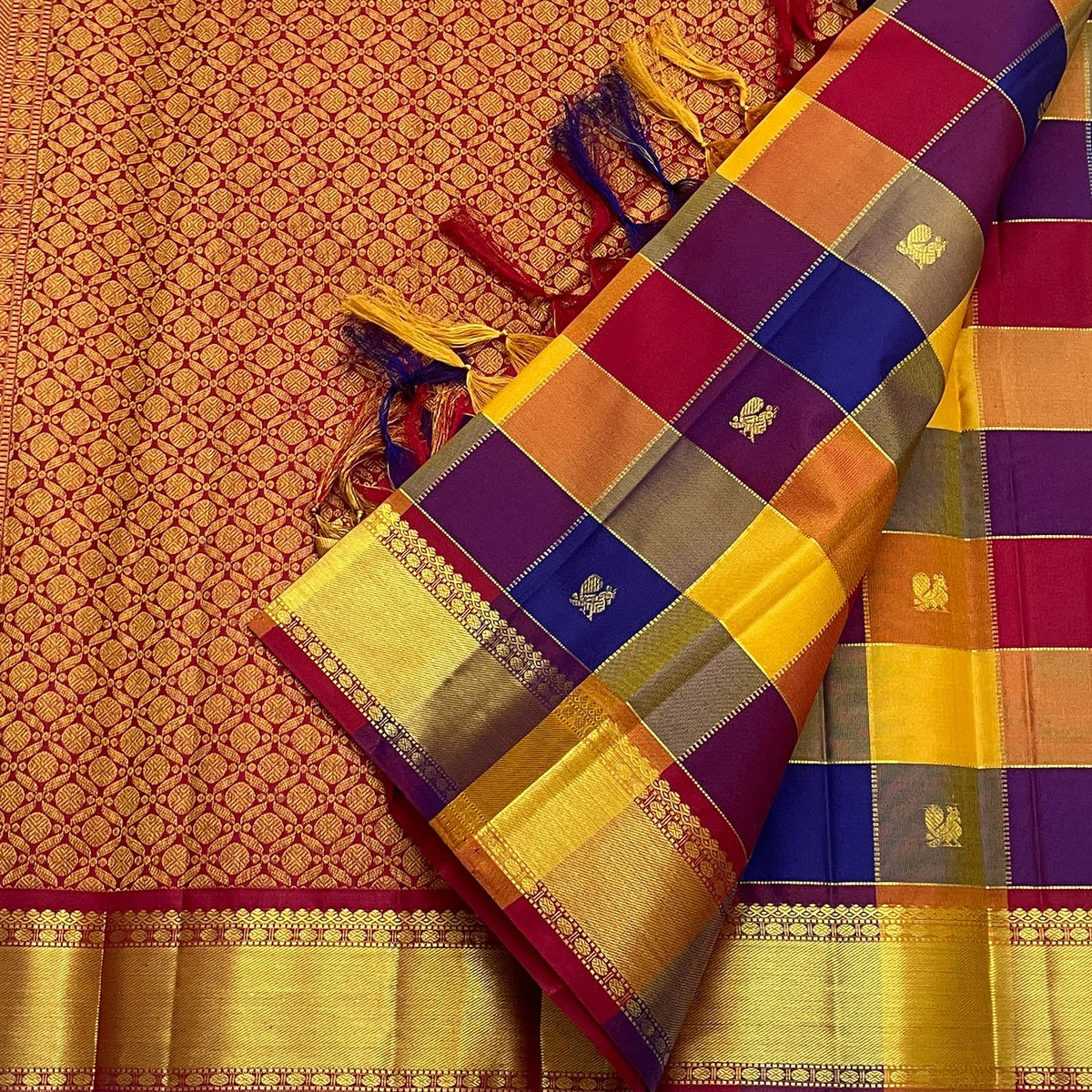 Handwoven Paalum Pazhamum Kanchipuram saree with Royal Blue Deep Purple and antique-gold zari details.