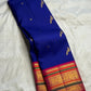 Close view of Royal Blue Korvai saree, Rani Pink pallu and layered green-and-gold zari border.