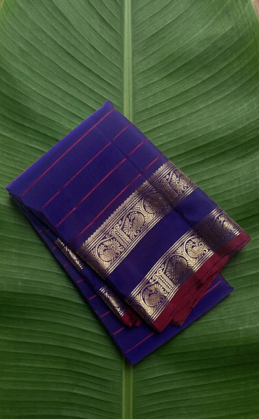Kanchipuram silk saree in royal blue with reddish pink border Veldhari Rettapet weave folded view