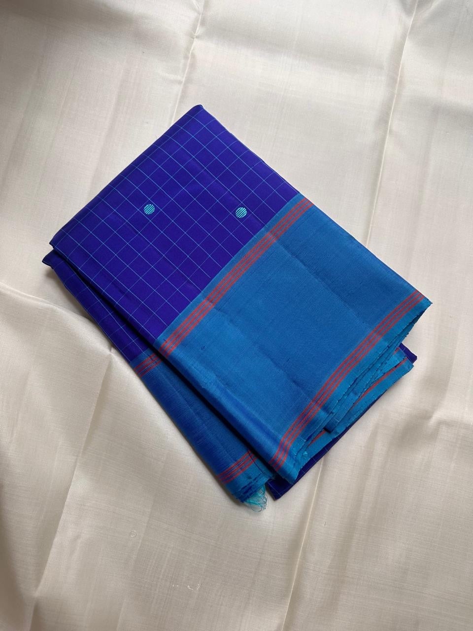 Fine turquoise checks and circular thread buttas, royal-blue Kanjipuram saree