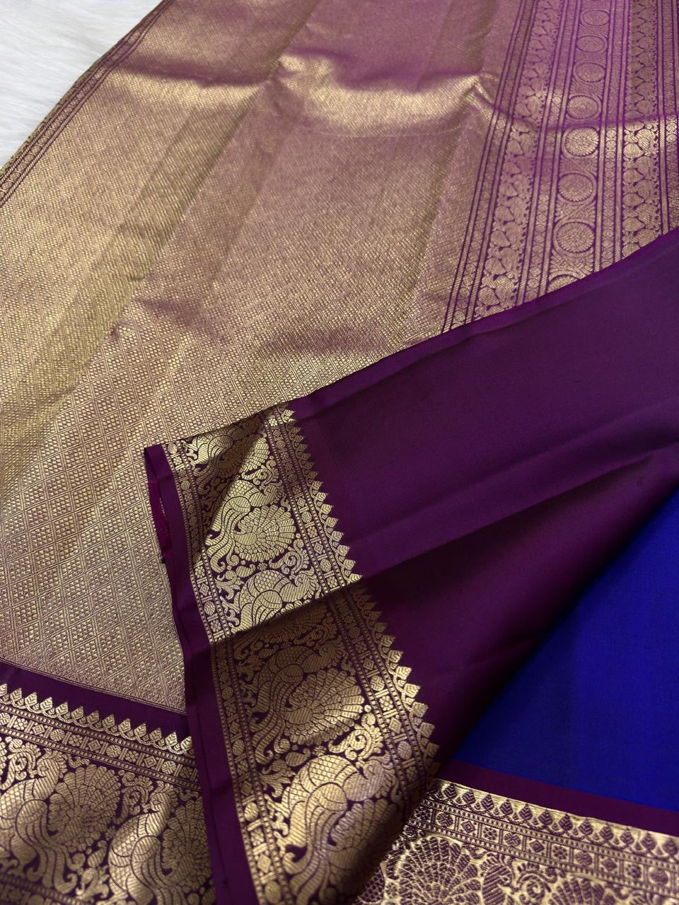 Blue pure silk Butta saree with Vadamalli Purple antique-gold Mayil border.