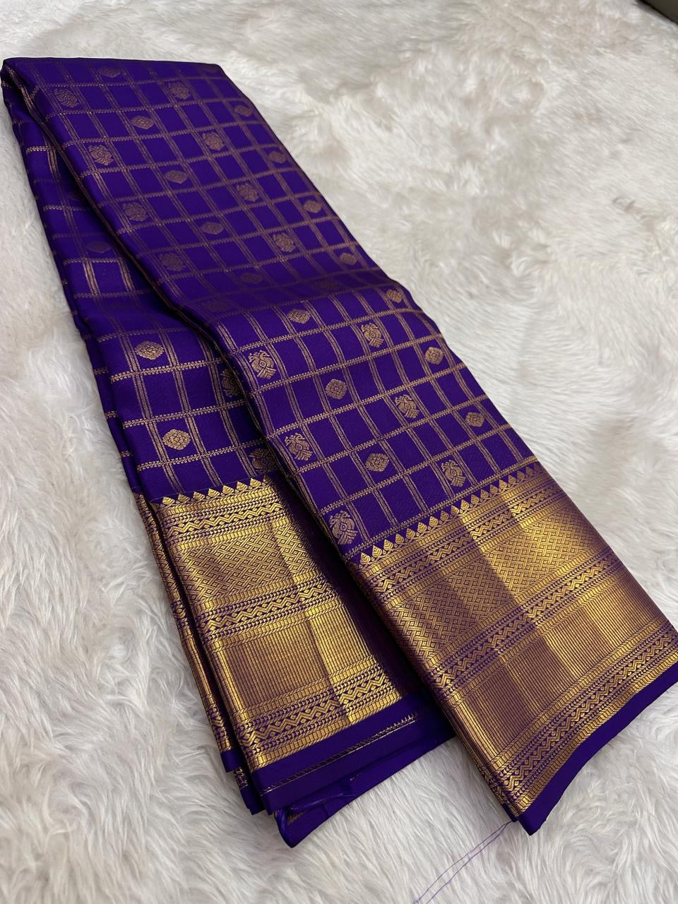 Gandaberunda Butta detail in gold zari on royal blue Kancheepuram body