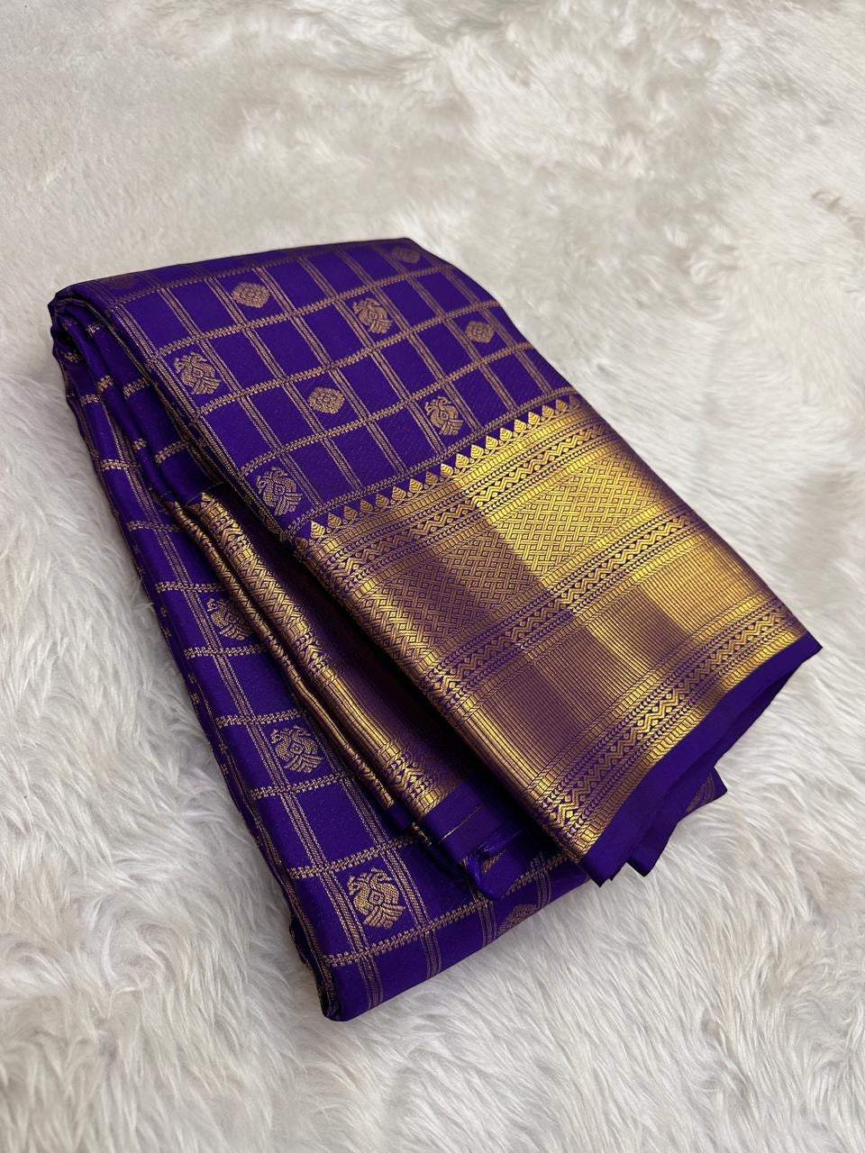 Folded view of royal blue pure silk Kancheepuram saree with Zari Kattam Gandaberunda Butta