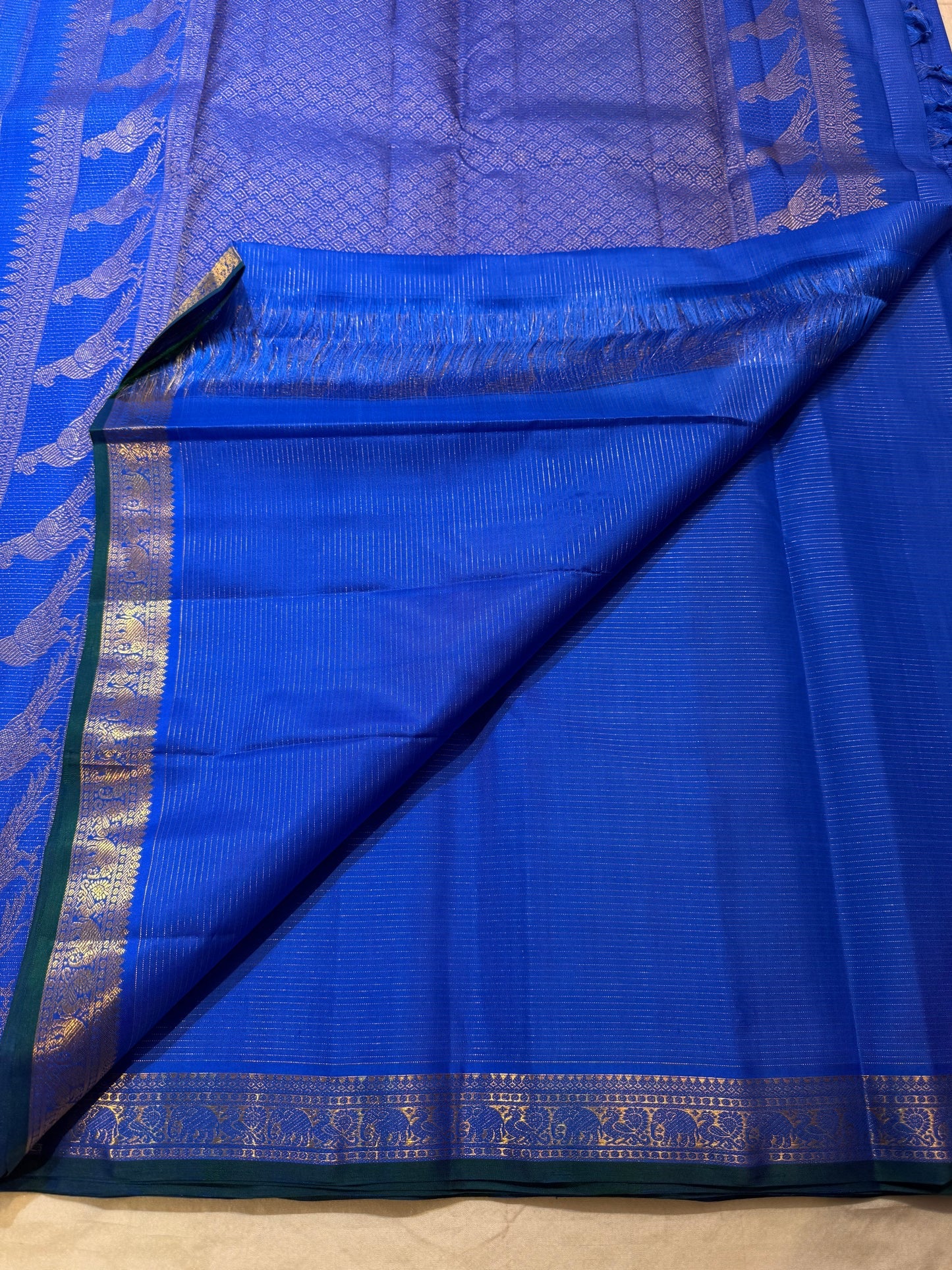 Close-up of the zari bird motif on a royal blue Kanjeevaram Vairaoosi saree body