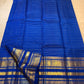 Close-up of the antique-gold peacock zari border on a royal blue Kanjivaram Vairaoosi saree