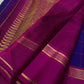 Jewel blue Kanjivaram silk with pink contrast border.