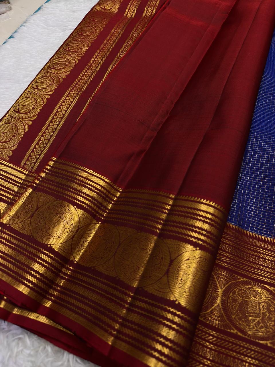 Contrast ruby red pallu on a royal blue Pure Silk Kanjivaram saree