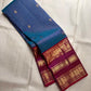 Magenta Varisaipet border detail with gold zari elephant and peacock motifs on royal blue Kancheepuram silk saree