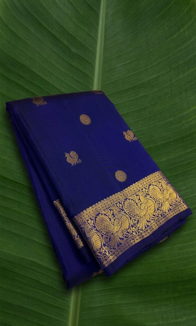 Pure Kanchipuram silk saree in royal indigo blue with antique gold peacock zari border