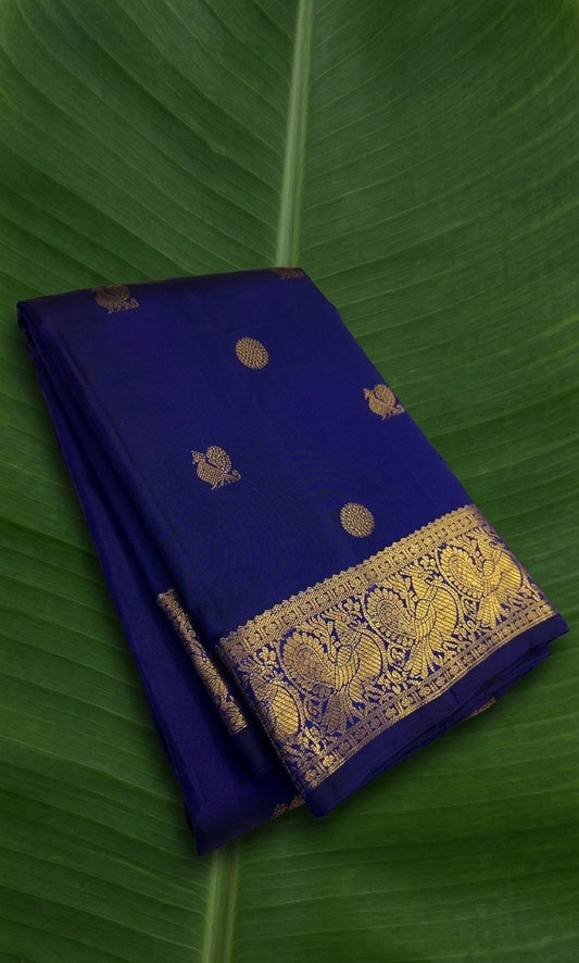 Pure Kanchipuram silk saree in royal indigo blue with antique gold peacock zari border