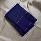 Deep sapphire blue handwoven Kanchipuram silk saree with fine zari pinstripes and luxurious silk finish