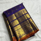 Full Royal Indigo Violet Vairaoosi saree showing gold buttas, broad zari borders and Burnt Orange edge