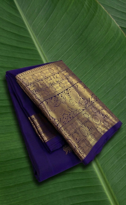 Pure Kanchipuram Butta silk saree in royal indigo blue with Yazhi buttas and antique gold zari border