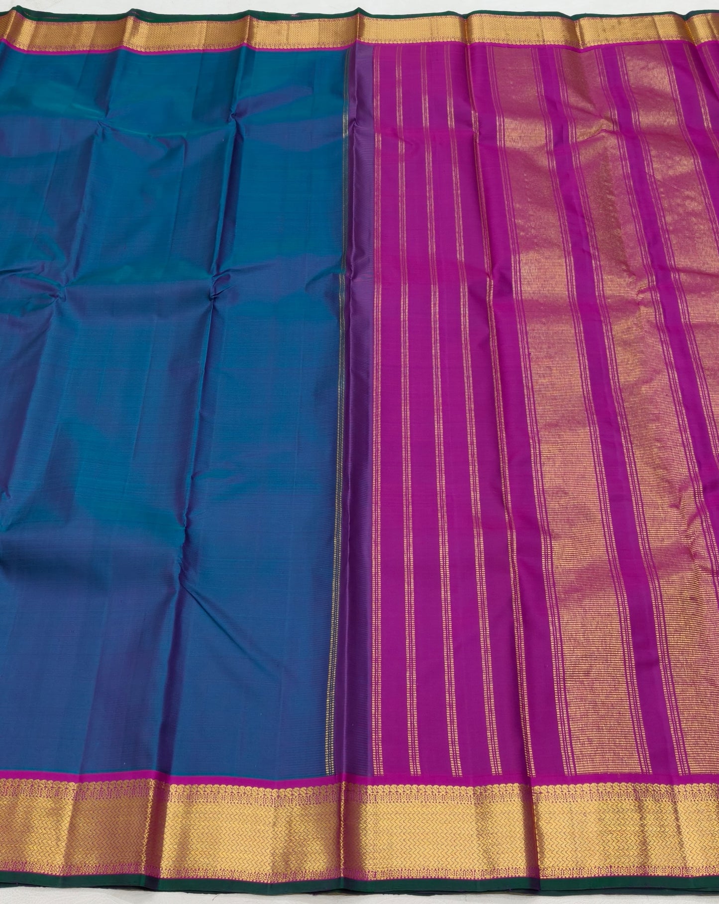Handwoven Kanchipuram silk saree royal ink blue with korvai border – drape detail
