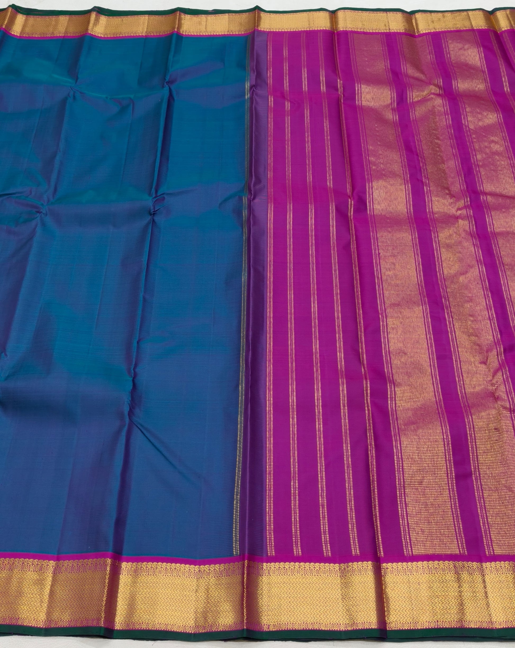 Handwoven Kanchipuram silk saree royal ink blue with korvai border – drape detail