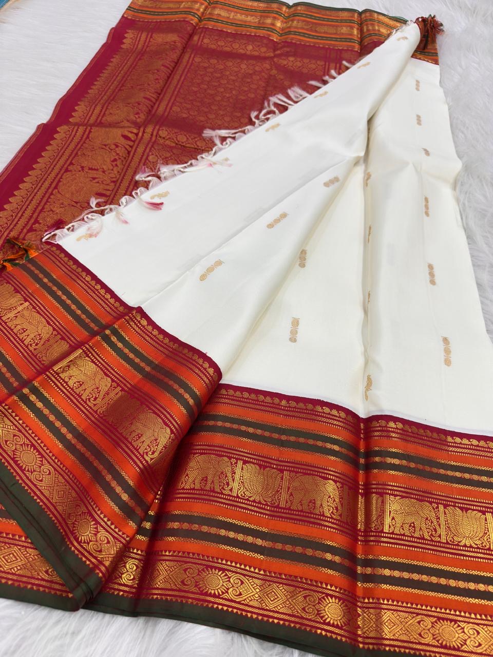 Close-up of royal ivory pure mulberry silk plain body, Kanchipuram Varisaipet saree