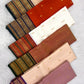 Close-up of heritage Varisaipet border in deep purple, bronze, and emerald zari on Royal Ivory KanchiPattu saree