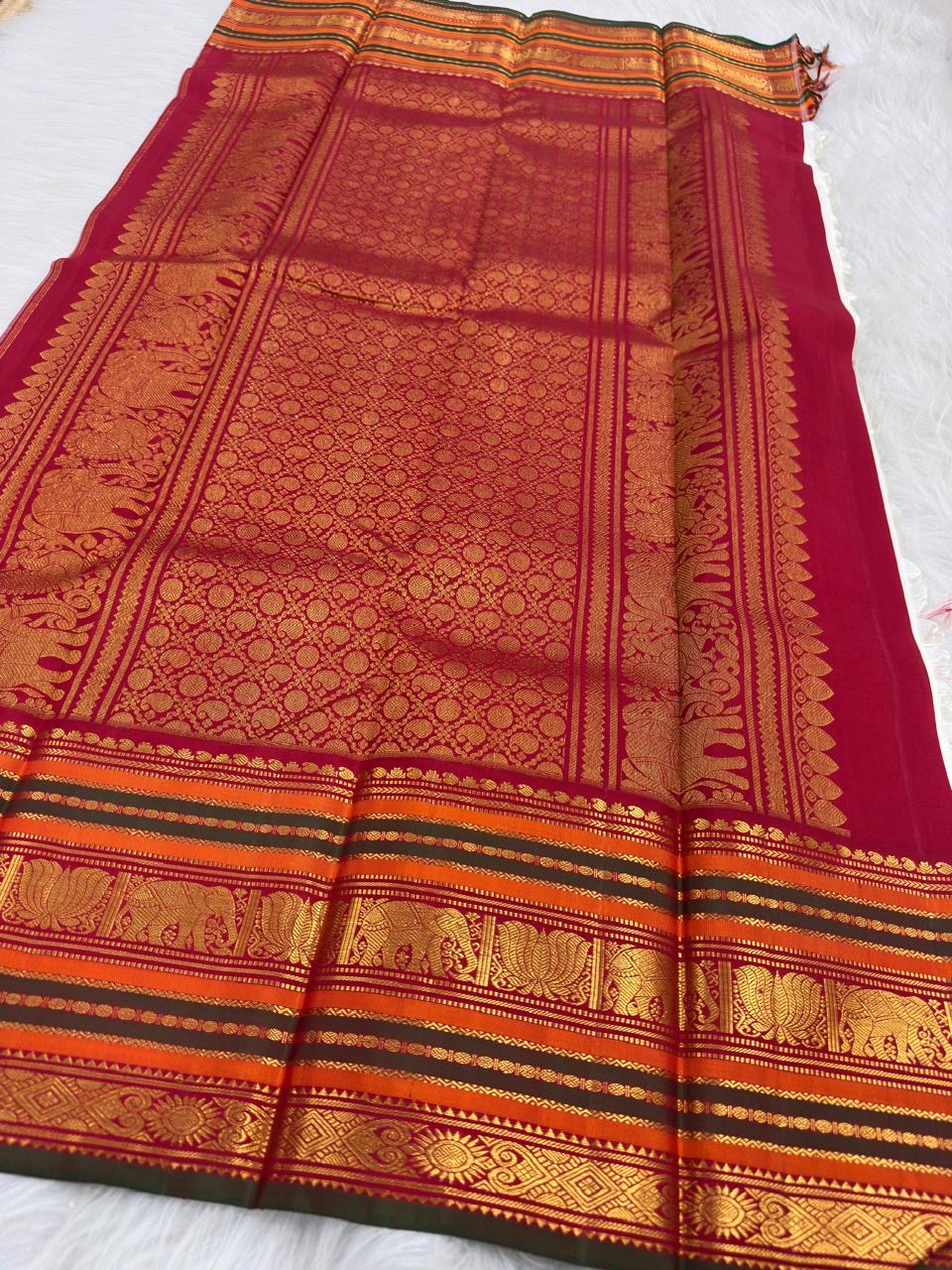 Full drape of Royal Ivory Kanchipuram Varisaipet saree with pillar box red border