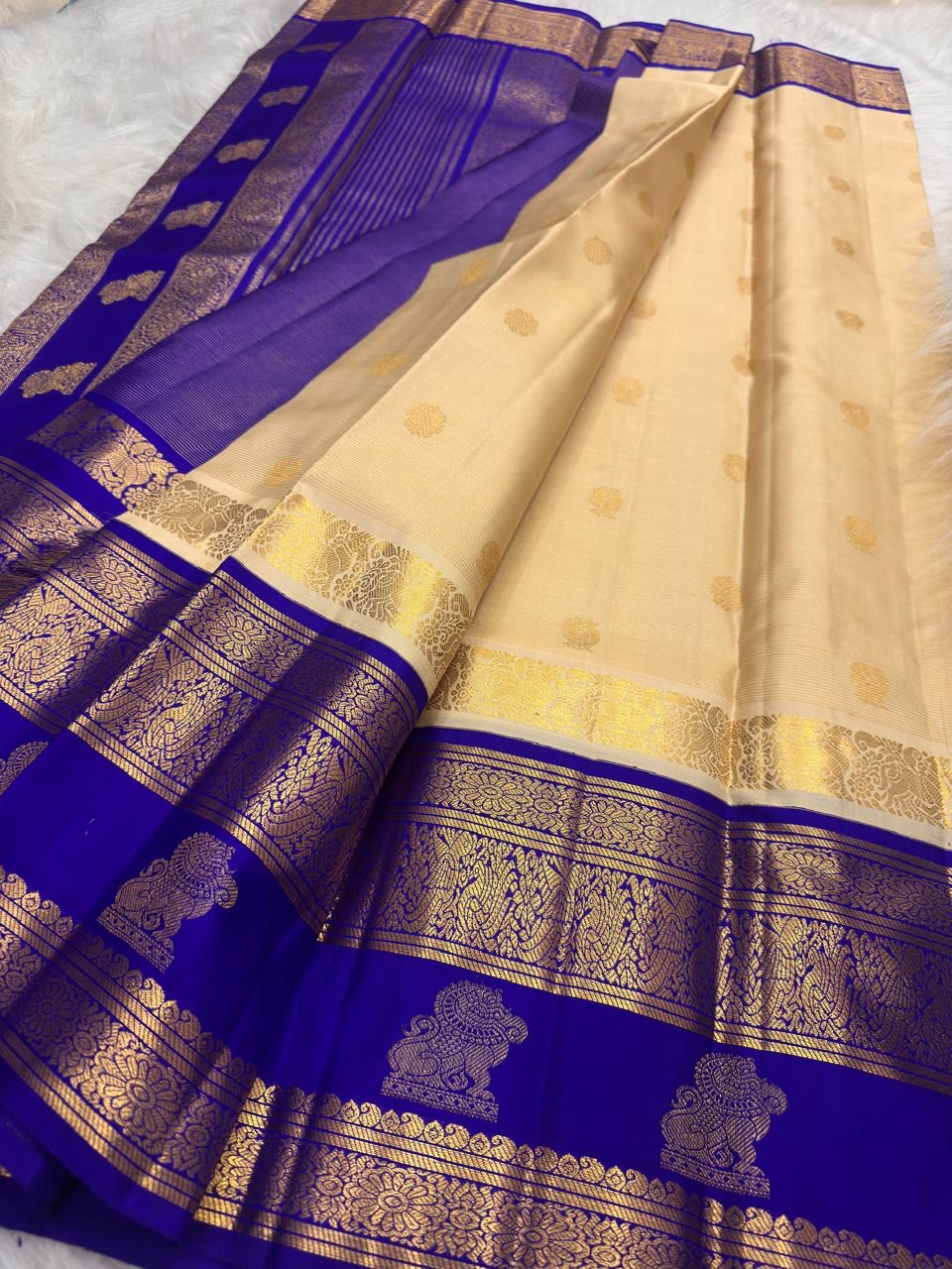 Royal Ivory Kanchi Pattu saree – Vanasringaram zari peacock border detail — Idam Living