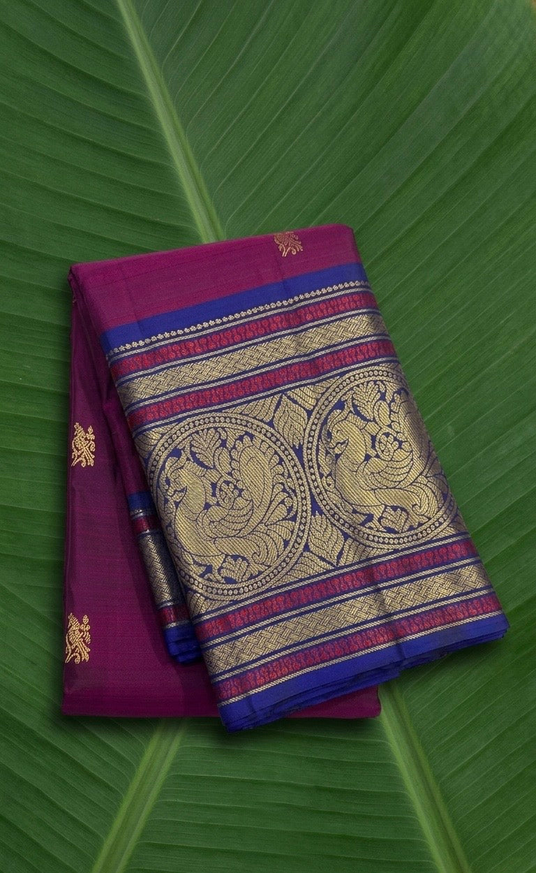 Royal magenta pink Kanjivaram silk saree with sapphire blue border – front view