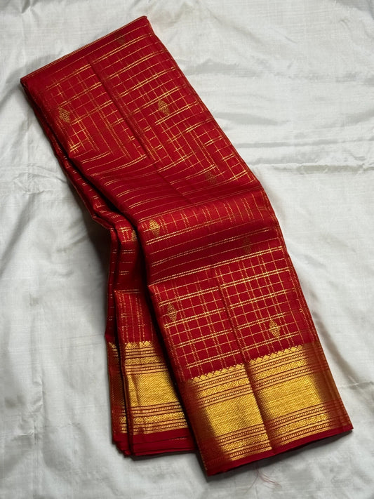 Imperial ruby Kanjivaram silk saree with diamond kamalam butta motifs and gold zari weave