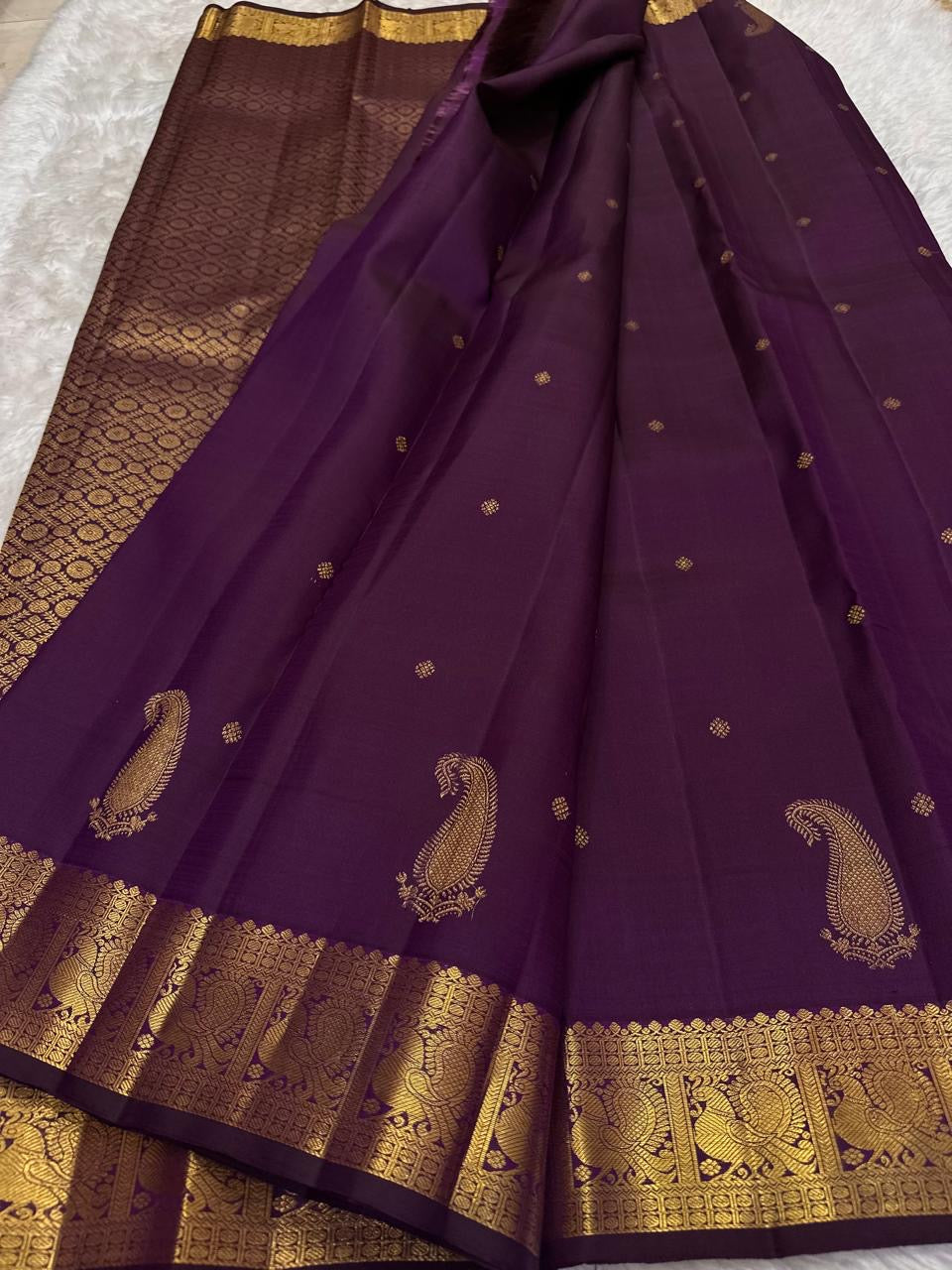Kanchipattu silk saree in royal purple with antique gold border Maanga Butta weave traditional zari detail