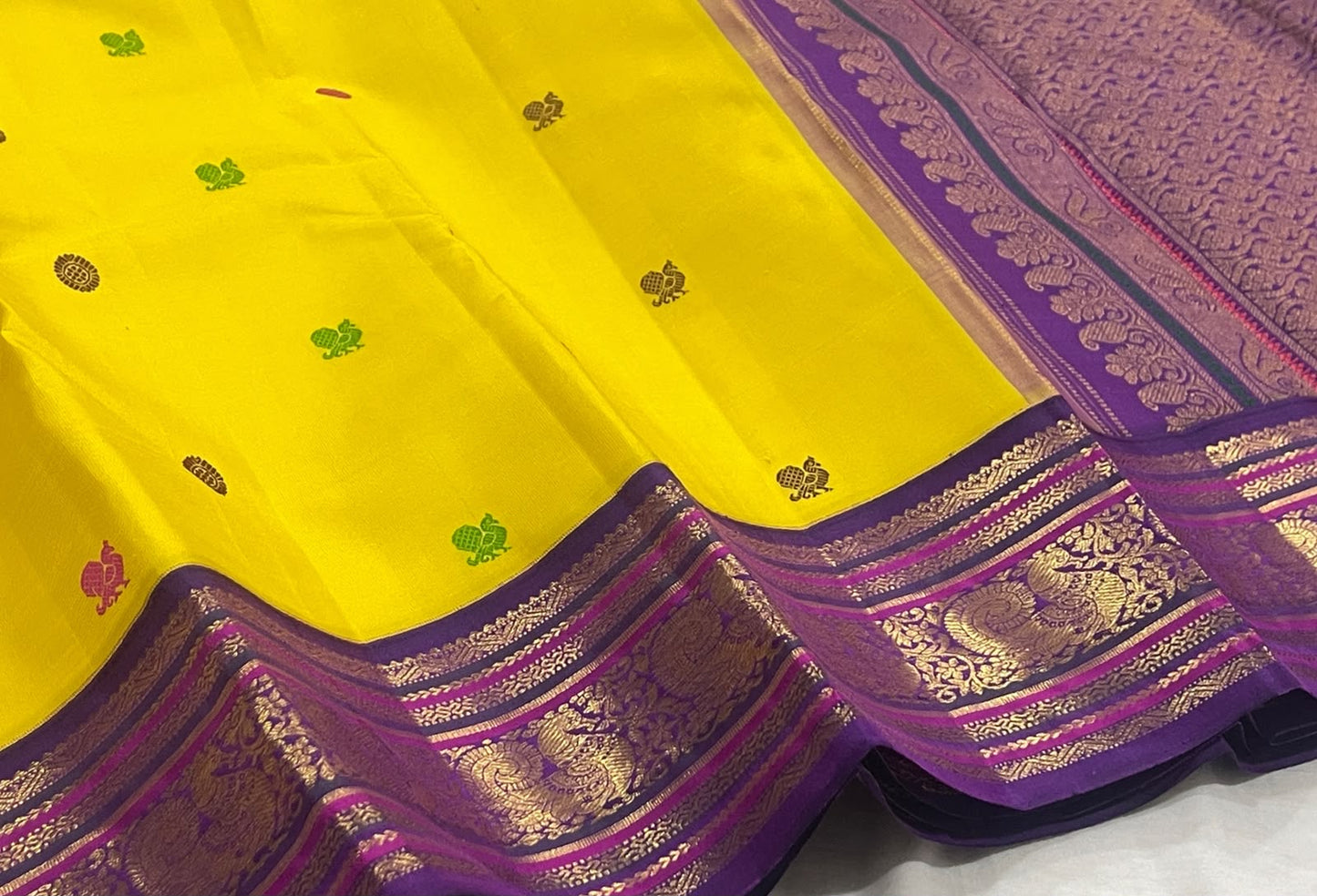 Turmeric Yellow pure silk Kanchipuram saree — royal purple border