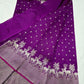 Detail of small silver floral buttas scattered across the Royal Purple Chanderi saree body