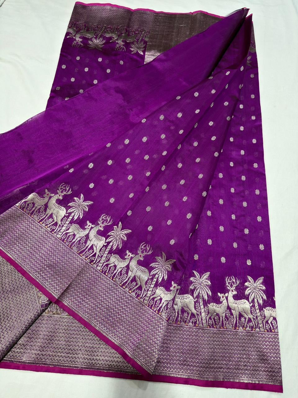 Detail of small silver floral buttas scattered across the Royal Purple Chanderi saree body