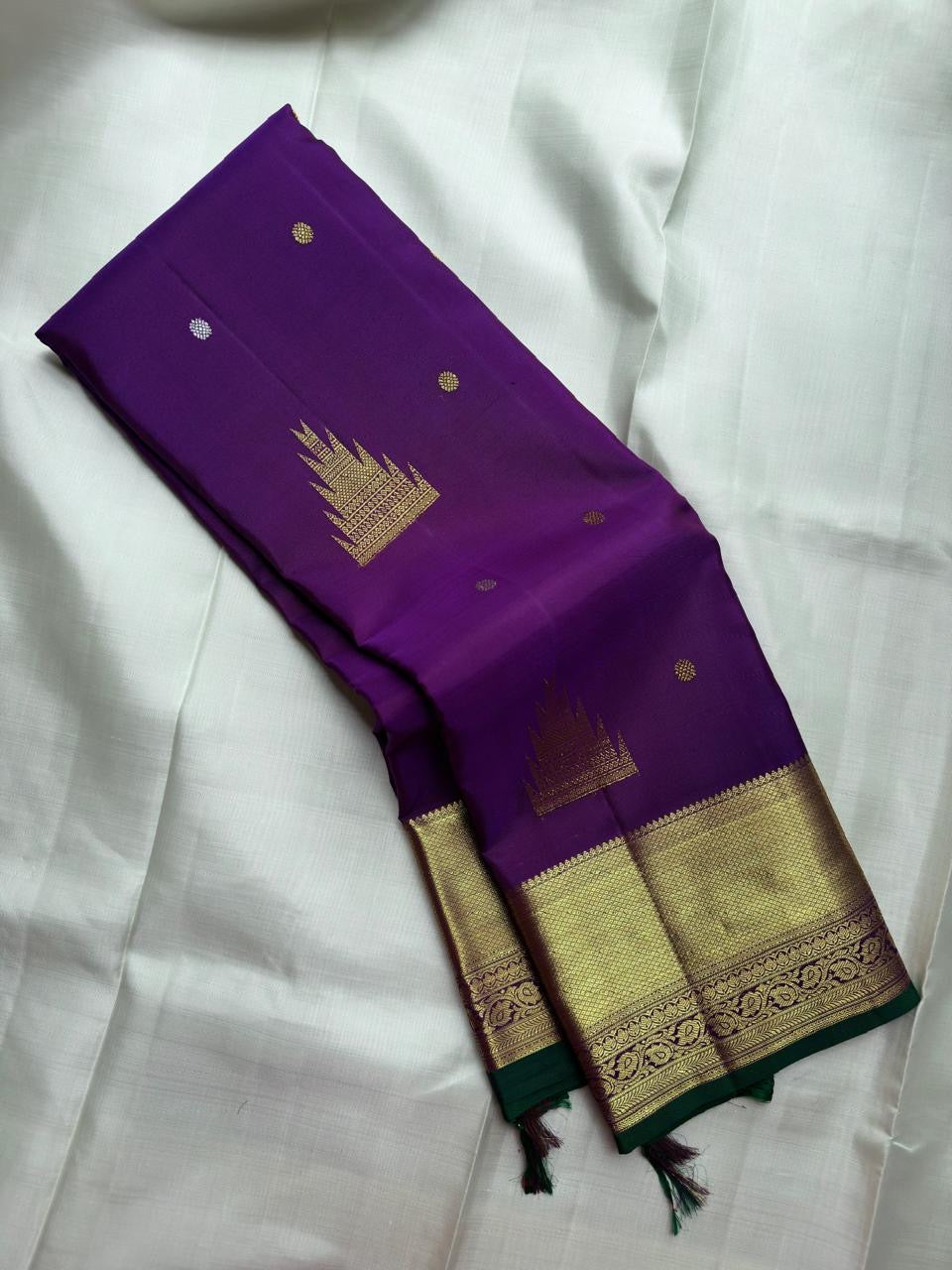 Royal Purple Kanjivaram silk saree with jewel-toned radiance and antique-gold zari.
