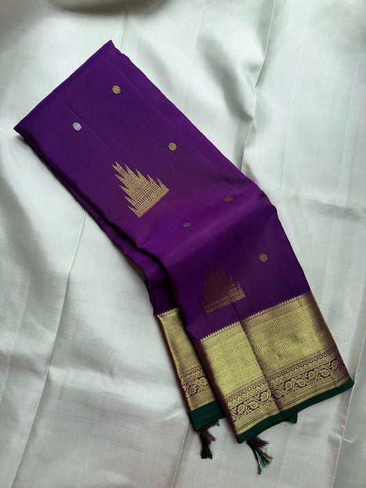 Royal Purple Kanjivaram silk saree with jewel-toned radiance and antique-gold zari.