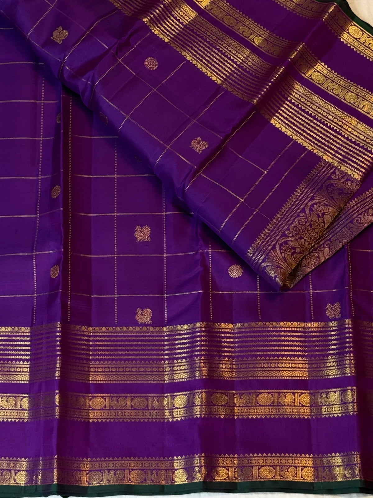 Antique-gold Varisaipet border on royal purple pure silk with repeated zari bands and narrow deep-green edge.