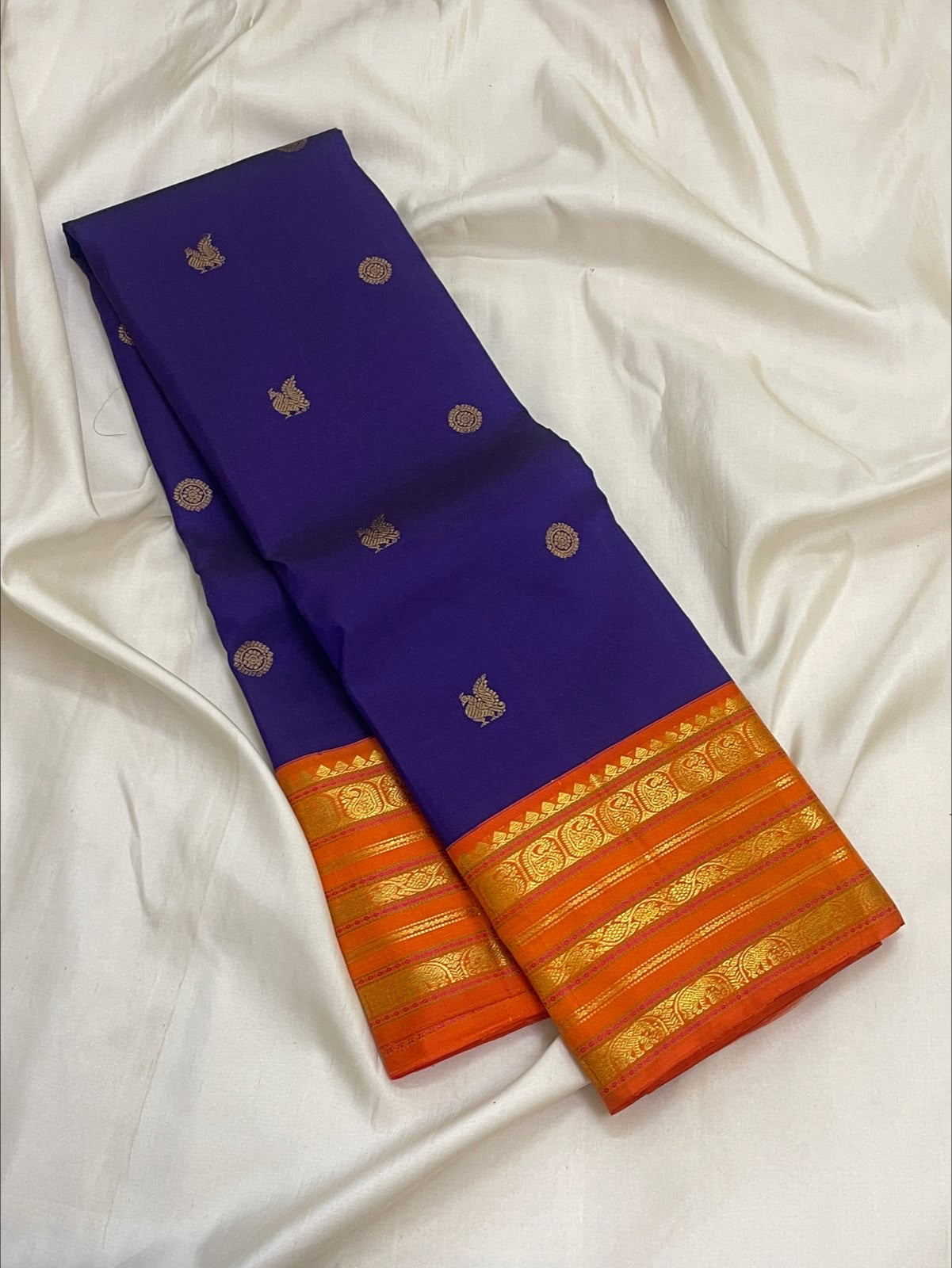 Royal Purple Kanjivaram body with traditional handwoven gold zari motifs