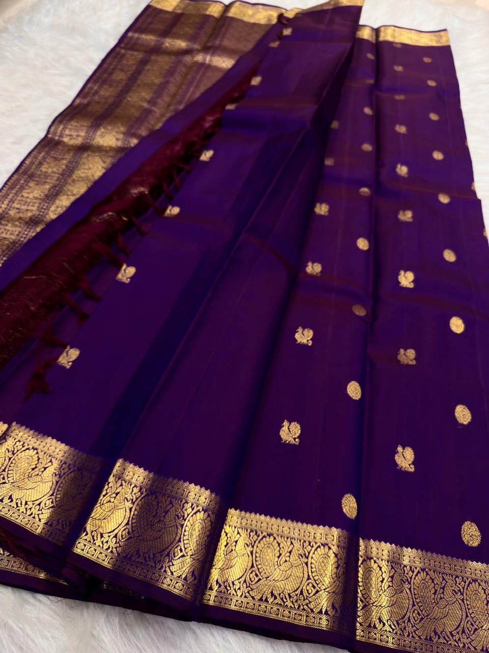 Handwoven Royal Purple Kanchipuram silk saree with alternating antique gold zari buttas