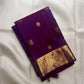Close view of antique gold zari buttas woven across Royal Purple Kanchipuram silk