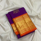 Close view of antique gold cow motifs woven across Royal Purple Kanchipuram silk