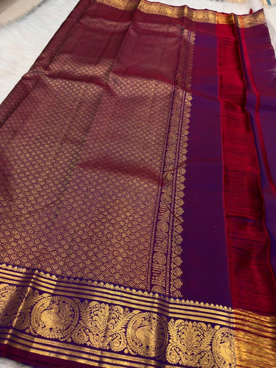 Royal purple Kanjipuram saree styled for a wedding occasion