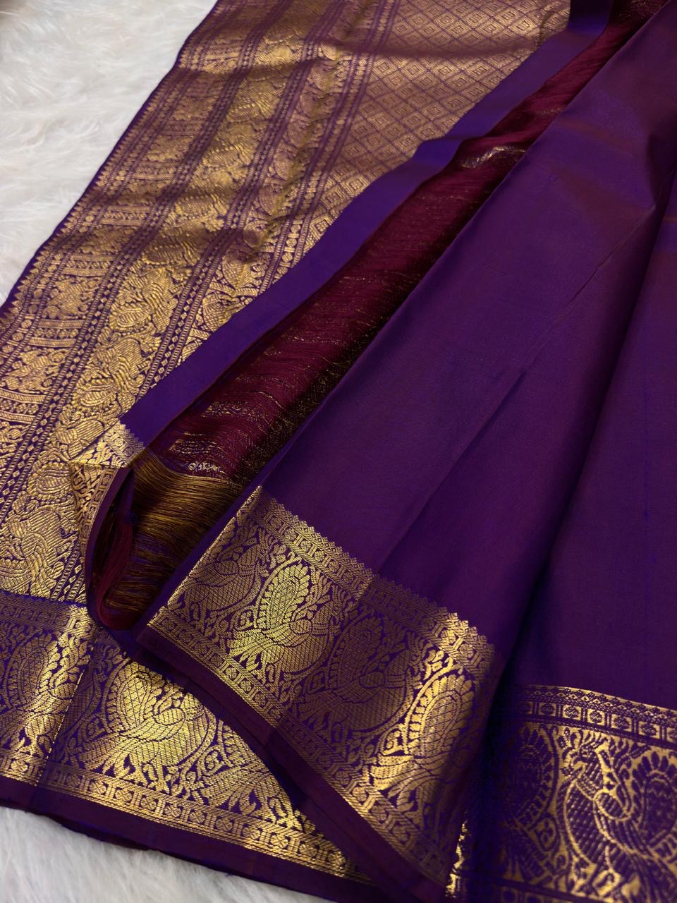 Pure Silk Kanchipuram Butta saree showing traditional Mayil zari border