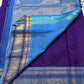 Turquoise blue Korvai border detail on a royal purple Kancheepuram saree