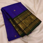 Royal-violet Kanchipuram silk with petite gold Mayil butta motifs.