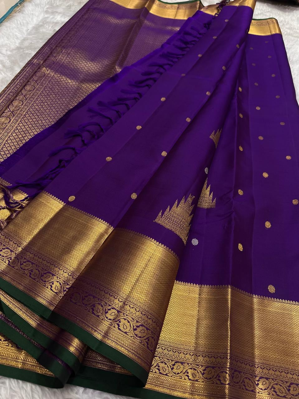 Handwoven Royal Purple Kanchipuram silk saree with antique-gold zari and Deep Green selvedge.