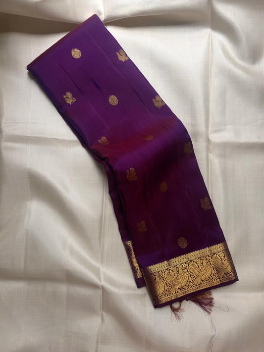 Royal Purple Pure Silk Kanjivaram Butta saree with antique gold zari motifs and Mayil border