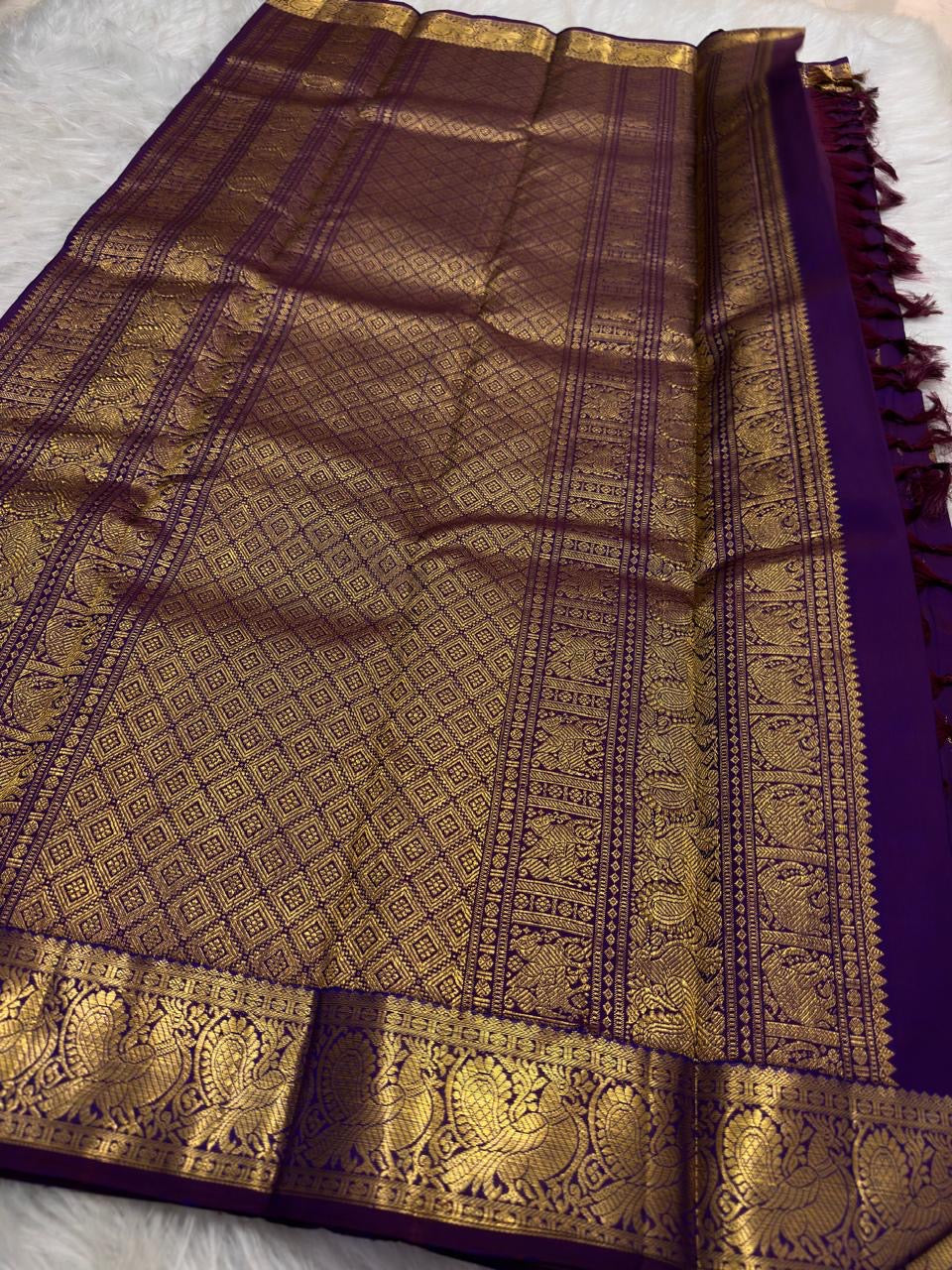Royal Purple Kanjivaram silk saree with grand antique gold zari woven pallu