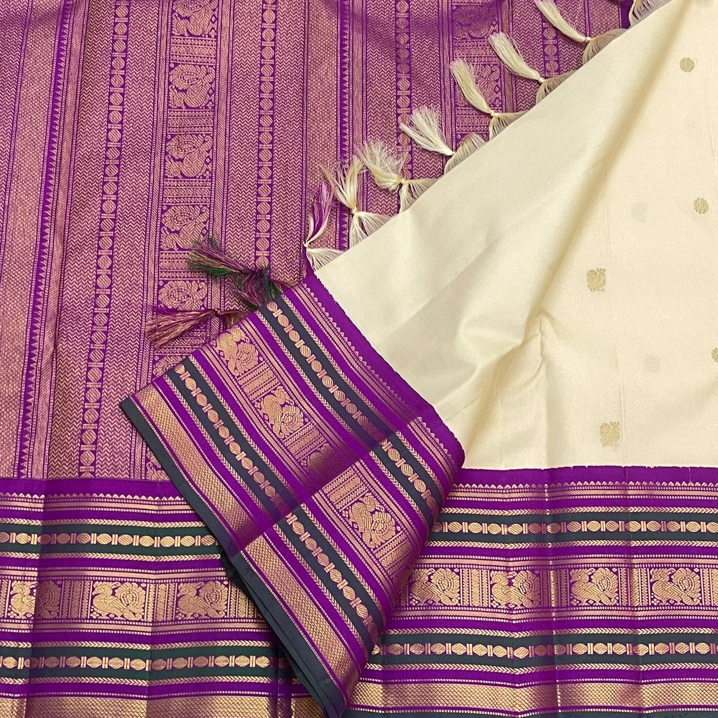 Pure Silk Kanchipuram Korvai saree with antique gold zari motifs and green accents