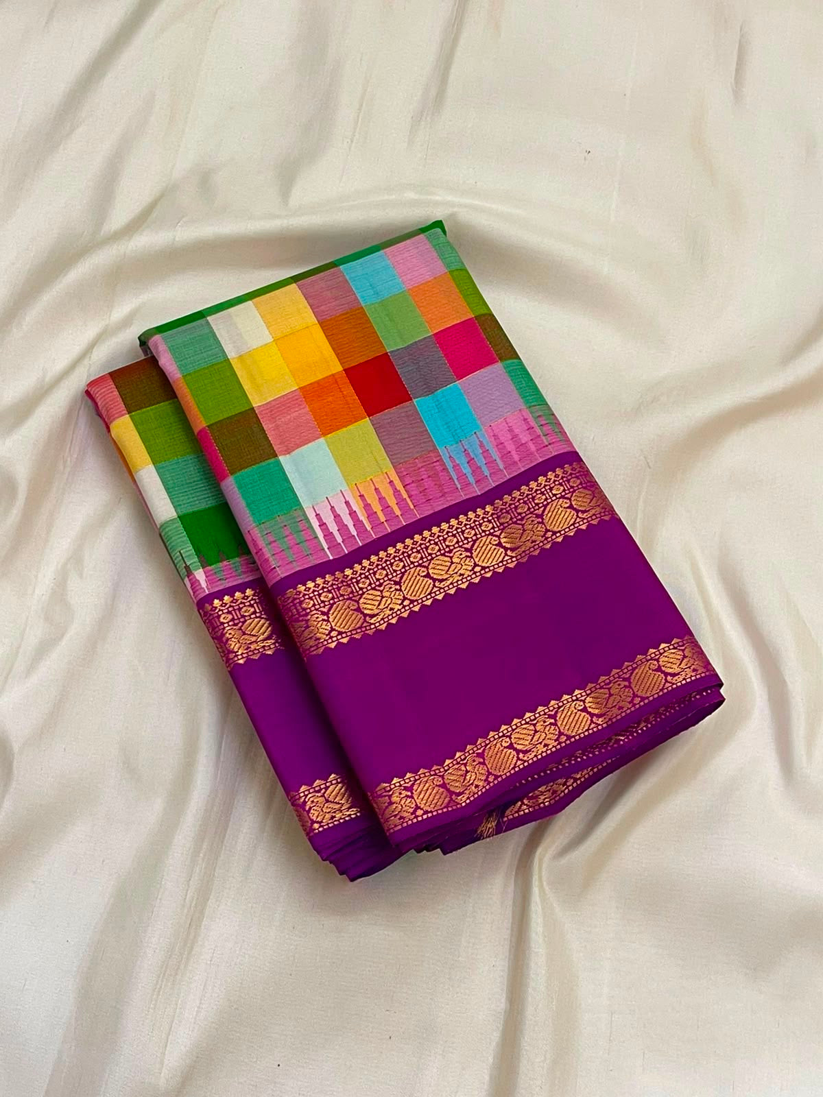 Royal purple Rettapet border detail on the multicoloured Paalum Pazhamum Kanchipuram saree