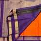 Royal purple Rettapet gold zari border detail on orange Kanchipuram silk saree