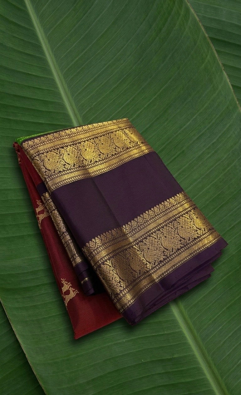 Pure Kanchipuram Rettapet silk saree in royal purple with rust red border and Yaanai zari weaving