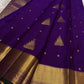 Royal Purple pure silk Kanjivaram Butta saree with traditional Thazhampoo Reku zari motifs.