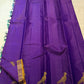 Close view of large antique-gold traditional bird motif on Royal Violet Kanchipuram silk.